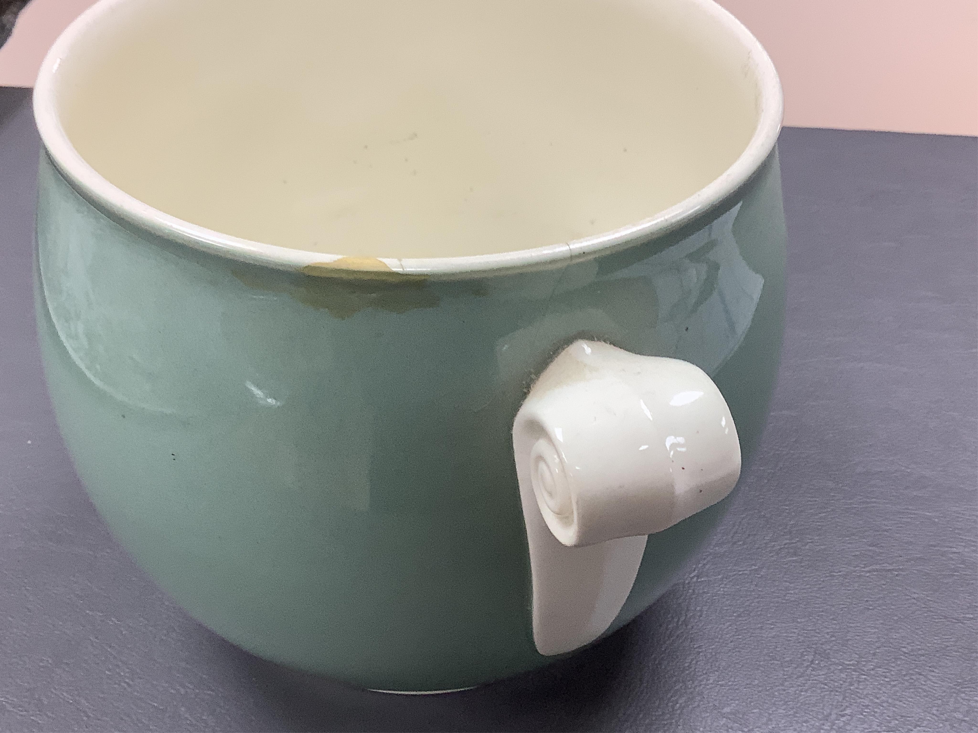 Keith Murray for Wedgwood - a celadon mug, two handled vase and two tazzas, tallest 13cm